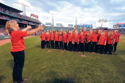 SCCC at Fenway Park
Leslie Piper directs the SouthCoast Children’s Chorus as they sing the National Anthem at Fenway Park when the Red Sox hosted the Yankees on Sunday, July 8.  Photo courtesy of the Red Sox. 

