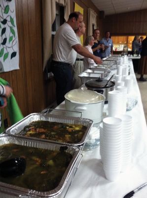 Top Chef
Scores of hungry Tri-Town residents lined up at Marion’s First Congregational Church on Saturday evening for the third annual Soup Cook-Off. The Rev. Sheila Rubdi provided the blessing, while Truman Tirrell provided the tunes. Old Rochester Regional Junior High Schoolers Kyla Horton, Julia Winters, and Michaela Mattson took first place in the Kale Soup division. Photos by Marilou Newell.
