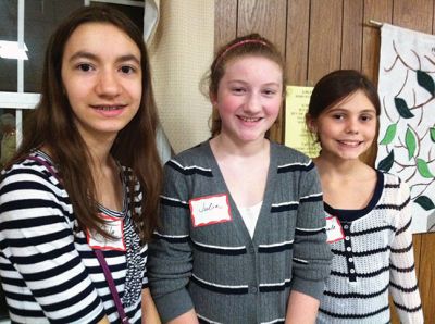 Top Chef
Scores of hungry Tri-Town residents lined up at Marion’s First Congregational Church on Saturday evening for the third annual Soup Cook-Off. The Rev. Sheila Rubdi provided the blessing, while Truman Tirrell provided the tunes. Old Rochester Regional Junior High Schoolers Kyla Horton, Julia Winters, and Michaela Mattson took first place in the Kale Soup division. Photos by Marilou Newell.
