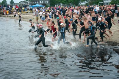 Triple Threat
Over two hundred athletes participated in this year's Mattapoisett Triathlon on Sunday morning, July 12. The athletes endurance was tested over a course which included a quarter-mile swim, a ten-mile bike ride and a three and three quarters-mile run. The race marks the beginning of the Mattapoisett Lions Club's annual Harbor Days Celebration with events including a craft fair, several suppers and a pancake breakfast , which unfold over the course of the week. Photo by Robert Chiarito. July 16, 2009 edition.
