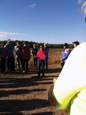 Buzzards Bay Coalition
Sara DaSilva Quintal, Restoration Ecologist with the Buzzards Bay Coalition, led a group of 50 Tri-Town residents and others from across the South Coast on an expedition into protected retired cranberry bogs last Saturday. Photo by Marilou Newell.
