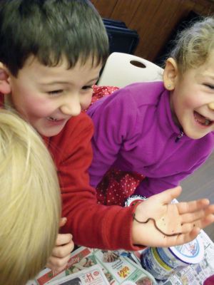 Composting
The SouthCoast Homeschoolers Eco Focus Group gathered at the Mattapoisett Library recently to build their own red wiggler farms. Pictured here, Josiah Filsinger and his sister Alyzah get their hands on some composting worms. Photo courtesy of Diana Mendes.
