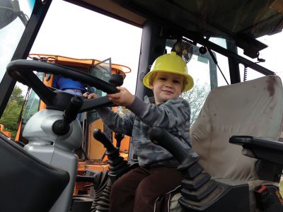 Big Trucks
Despite the soggy weather on Saturday, May 11th, close to 100 kids of all ages came to Marion Recreation’s Kid’s Equipment Day held at Town Field on Main Street. Kids were able to climb and explore a fire truck, ambulance, bucket truck, police cruiser, street sweeper and construction vehicles. All children received a free fire hat or construction hat. Many volunteers were on hand to assist the kids and to answer any questions. 
