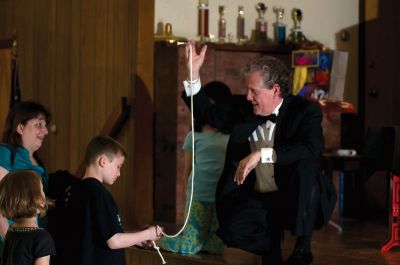 Magic Hour
It was a magic time at the First Congregational Church in Marion on Saturday, May 1, 2010, when the church hosted a magic show with Marcus the Magician at their community center. Throughout the show, children laughed and helped the magician by yelling out tips and observations. Some children even got to help Marcus the Magician on stage. Photo by Felix Perez.
