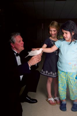 Magic Hour
It was a magic time at the First Congregational Church in Marion on Saturday, May 1, 2010, when the church hosted a magic show with Marcus the Magician at their community center. Throughout the show, children laughed and helped the magician by yelling out tips and observations. Some children even got to help Marcus the Magician on stage. Photo by Felix Perez.
