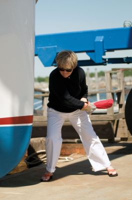 M/V Mattapoisett 
Jennifer Collyer, wife of Karl Collyer who passed away February 2010, christens the M/V Mattapoisett in his honor. "M/V Mattapoisett was the call sign of Mr. Collyer who worked 40 years at the Mattapoisett Boat Yard and also served as harbormaster in the 1970s. Photo by Felix Perez.
