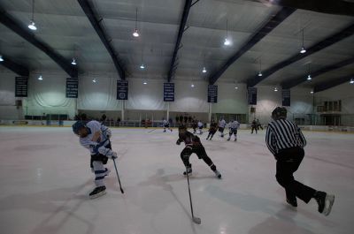 ORR Hockey
On Saturday, January 19, the Old Rochester Regional Varsity Ice Hockey Team ventured to the John Gallo Ice Arena in Bourne to face off against the Wareham Vikings.  Members of the ORR team check out the scoreboard, which was quite active all night.  The official score for the game was 12-2 in ORR’s favor, however, the scoreboard stopped keeping score at 8-2 due to the landslide victory.  The win marked ORR’s sixth of the season, while the Vikings haven’t recorded a win yet.  Photo by Felix Perez.
