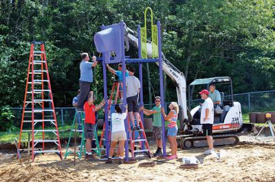 Rochester Memorial School Playground
Dozens of volunteers gathered at Rochester Memorial School on Saturday to construct a new playground for the students there. “We started in February,” said Playground Project Chair Donna Forcier, “and here we are – finally.” New RMS principal Derek Medeiros was also on hand to help with the build. Photo by Nick Walecka.
