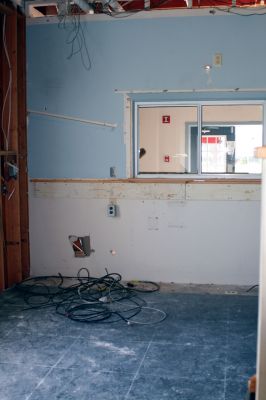 Police Progress
Much of the first floor of the Mattapoisett police station first floor is stripped down to studs, thanks to a May 28 second-floor burst pipe that did serious damage to the building. The second floor will need a new floor and the first floor needs new ceiling tiles, new drywall and flooring. Photo by Anne OBrien-Kakley.
