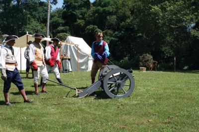 Heritage Days
Revolutionary War re-enactors (left to right) Chris Richard, Tim Smith, Chuck Cromwell and Wayne Oliviera look on as Frank Matthew loads a Colonial cannon on Saturday, August 7. The re-enactors spent the night at the Mattapoisett River as part of Mattapoisett's Heritage Days, which took place from Friday, August 7 to Sunday, August 9. Photo by Adam Silva
