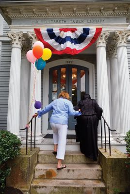 Elizabeth Taber Library
The Elizabeth Taber Library’s Open House featured a very important guest last week: Elizabeth Taber herself, as played by Natalie Hemingway. The festivities included a cake to celebrate what would be the Marion benefactor’s 222nd birthday, a presentation from Hemingway and Library Director Libby O’Neill, and more. Photo by Shawn Badgley. 
