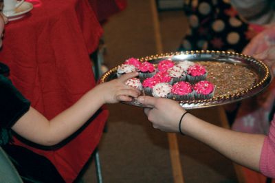 Valentine Tea
The Marion Art Center hosted an American Girl themed Valentine Tea Party on February 6, 2010. Over 20 girls dressed in their pink and red finest enjoyed dainty finger foods, festive cupcakes, red fruit punch, and tea. Morgan Middleton played Kirsten and Phoebe Mock played Singing Bird in the Marion Art Center American Girl mini-musical that accompanied the tea party. Photo by Anne OBrien-Kakley.
