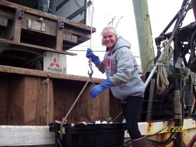 Seafaring Women
Tina Jackson unloads the day's catch. Ms. Jackson will share her experiences as a woman working in the commercial fishing industry following the film Shipping Out: The Story of American's Seafaring Women on March 18, 2011 at the Corson Maritime Learning Center, located at 33 William Street in downtown New Bedford. The program is free to the public. Photo courtesy of Laura Orleans. 
