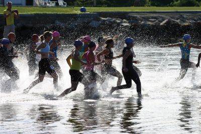 2011 Triathlon
240 athletes kicked off the Harbor Days week on July 10, 2011 with the Mattapoisett Lions Triathlon, which started from Mattapoisett Town Beach and included a .25-mile swim, a 10-mile bike ride and a 3-mile run. The mens winner for the Triathlon was Keith Putnam or Marston Mills, MA with a time of 52:52, and the womens winner was Katie McCully of Eastham, MA with a time of 58:51. Photo by Anne Kakley.
