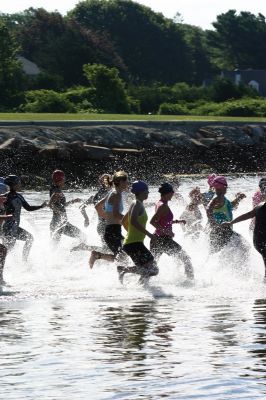 2011 Triathlon
240 athletes kicked off the Harbor Days week on July 10, 2011 with the Mattapoisett Lions Triathlon, which started from Mattapoisett Town Beach and included a .25-mile swim, a 10-mile bike ride and a 3-mile run. The mens winner for the Triathlon was Keith Putnam or Marston Mills, MA with a time of 52:52, and the womens winner was Katie McCully of Eastham, MA with a time of 58:51. Photo by Anne Kakley.
