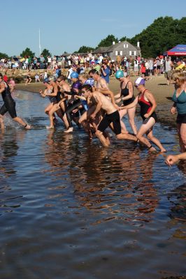 2011 Triathlon
240 athletes kicked off the Harbor Days week on July 10, 2011 with the Mattapoisett Lions Triathlon, which started from Mattapoisett Town Beach and included a .25-mile swim, a 10-mile bike ride and a 3-mile run. The mens winner for the Triathlon was Keith Putnam or Marston Mills, MA with a time of 52:52, and the womens winner was Katie McCully of Eastham, MA with a time of 58:51. Photo by Anne Kakley.
