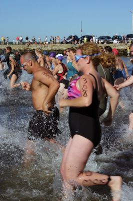 2011 Triathlon
240 athletes kicked off the Harbor Days week on July 10, 2011 with the Mattapoisett Lions Triathlon, which started from Mattapoisett Town Beach and included a .25-mile swim, a 10-mile bike ride and a 3-mile run. The mens winner for the Triathlon was Keith Putnam or Marston Mills, MA with a time of 52:52, and the womens winner was Katie McCully of Eastham, MA with a time of 58:51. Photo by Anne Kakley.
