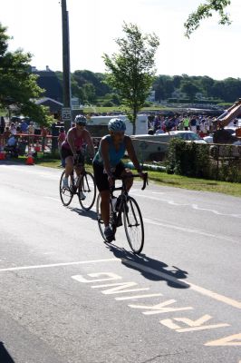 2011 Triathlon
240 athletes kicked off the Harbor Days week on July 10, 2011 with the Mattapoisett Lions Triathlon, which started from Mattapoisett Town Beach and included a .25-mile swim, a 10-mile bike ride and a 3-mile run. The mens winner for the Triathlon was Keith Putnam or Marston Mills, MA with a time of 52:52, and the womens winner was Katie McCully of Eastham, MA with a time of 58:51. Photo by Anne Kakley.
