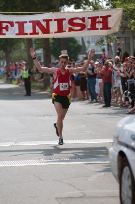 Top Runner
16-year-old Jonathan Green of Berlin, MA, crossed the finish line with a time of 27:10, making him the Men's winner at the 2011 Mattapoisett Road Race. Photo by Felix Perez.
