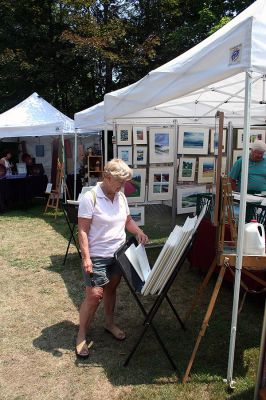 Arts in the Park
The Marion Arts Center once again sponsored "Arts in the Park" in Bicentennial Park across the street from the Marion Town House on Saturday, July 12. Forty-five artists and artisans set up displays of their work in a variety of media including ceramics, clothing, jewelry, glass, scrimshaw, accessories, paper, photography, furniture, decorative arts as well as paintings and prints. (Photo by Robert Chiarito).
