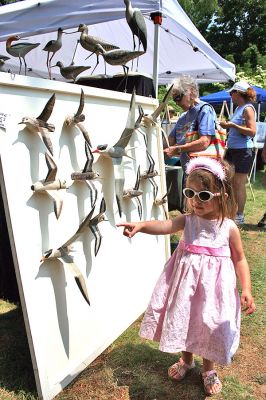 Arts in the Park
The Marion Arts Center once again sponsored "Arts in the Park" in Bicentennial Park across the street from the Marion Town House on Saturday, July 12. Forty-five artists and artisans set up displays of their work in a variety of media including ceramics, clothing, jewelry, glass, scrimshaw, accessories, paper, photography, furniture, decorative arts as well as paintings and prints. (Photo by Robert Chiarito).
