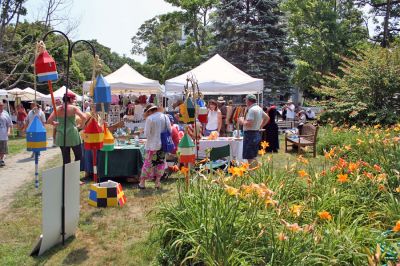 Arts in the Park
The Marion Arts Center once again sponsored "Arts in the Park" in Bicentennial Park across the street from the Marion Town House on Saturday, July 12. Forty-five artists and artisans set up displays of their work in a variety of media including ceramics, clothing, jewelry, glass, scrimshaw, accessories, paper, photography, furniture, decorative arts as well as paintings and prints. (Photo by Robert Chiarito).
