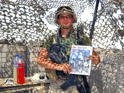 Tour of Duty
Corporal Denham of Rochester poses with a copy of The Wanderer while serving his second tour of duty with the United States Marine Corps in Iraq. (1/11/07 issue)
