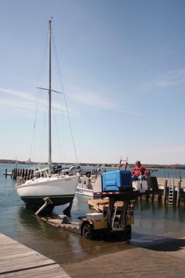 Launching Into Summer
Another sailboat is launched into Mattapoisett Harbor recently in anticipation of the busy summer sailing season after a long winter hibernation. As Memorial Day quickly approaches, more and more vessels will begin dotting the harbors in both Mattapoisett and Marion as residents prepare to enjoy the scenic waters of both seaside communities. (Photo by Robert Chiarito).
