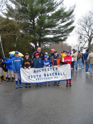 "Play Ball" ... Opening Day in Rochester
Ball players representing several of the teams which comprise Rochester Youth Baseball (RYB) were on hand to participate in this seasons Opening Day Parade in Rochester center. Despite inclement weather, the event drew a sizeable crowd and the teams joined in an orderly procession from the town green to the Dexter Lane baseball field last weekend. (Photo by Nancy MacKenzie).
