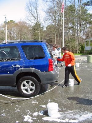 Workin' at the Car Wash
Members of the Old Rochester Youth Football and Cheerleading (ORYF) League recently held a benefit Car Wash at the Marion Fire Station on Spring Street. Over the next month, the league will be holding a series of car washes to raise money for uniforms, pads, footballs, poms-poms, first aid kits, and other necessary supplies and fees. The next Car Wash is slated for this Saturday, April 29 at the Mattapoisett Fire Station on Route 6 from 9:00 am to 2:00 pm. (Photo by Nancy MacKenzie).
