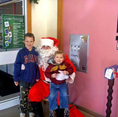 Santa's Mailbag
Jolly Ol Saint Nick himself visited the Rochester Post Office on Saturday, December 16 before making final preparations for his big night on December 24. These are a few of the many Rochester children that met with Santa and offered their last-minute wish lists. Customers coming in to mail out their Christmas gifts and cards were also offered complimentary beverages and goodies for their patronage throughout the year. (Photo courtesy of James Dries).
