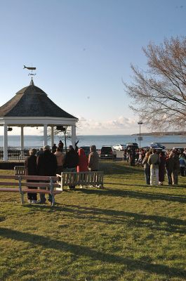 Sunrise Shipyard Service
Members and guests of the Mattapoisett Congregational Church gathered in the town's Shipyard Park for their annual Easter Sunrise Service with Reverend Dr. Virginia H. Child on Sunday, April 8. The chilly but tranquil setting of the harbor glistening in the early morning golden sunlight served well to complement Reverend Child's sermon on peace and renewal. (Photo by Robert Chiarito).
