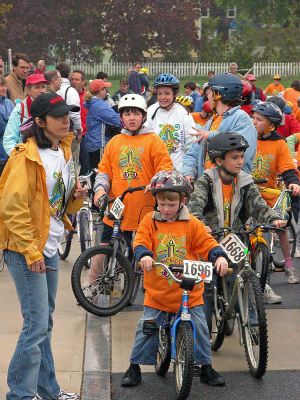 Tri-Town Bike Benefit
Several hundred children and their parents braved soggy conditions to participate in the first annual Pan-Mass Challenge (PMC) Tri-Town Ride for Kids on Saturday, May 19 starting at Center School on Barstow Street in Mattapoisett. The young bikers arrived with the goal of pedaling their way towards raising $10,000 in the fight to find a cure for cancer. Children ranging in age from 3 to 15 years were encouraged to participate in the bike rally benefit. (Photo by Robert Chiarito).
