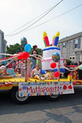 Party Parade
One of the unique floats in Mattapoisetts 150th Sesquicentennial Parade, created and sponsored by Little Peoples College, extends a Happy Birthday wish to the town and its residents. The sprawling three-division parade boasting two marching bands was held on Saturday morning, August 4 and traveled from the Mattapoisett Town Hall through the village area, drawing hundreds of spectators along the way. (Photo by Kenneth J. Souza).
