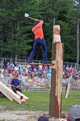 Chop Off the ol' Block
The popular Woodsman Show kicked off a weekend full of old-fashioned, family-friendly fun and entertainment as the Eighth Annual Rochester Country Fair got underway. Here a participant chops his way through the springboard competition during Friday nights show. Throngs of people made their way to Rochesters town center on August 17, 18 and 19 to enjoy sack races, bullfrog races, a block dance and bonfire, and a festive parade on Sunday with the theme Set Sail to the Islands. (Photo by Robert Chiarito).
