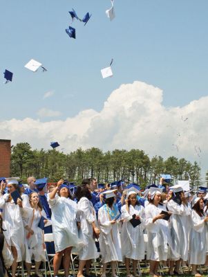 Leaving Home
A sea of white and blue caps and gowns dotted the campus of Upper Cape Tech Regional High School for the first time in 38 years last Sunday, June 1, as 150 students  the schools largest graduating class to date  received their diplomas on their own home turf after years of holding commencement at nearby Bourne High School. (Photo by Kenneth J. Souza).
