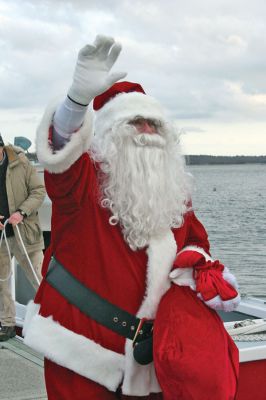 Nautical St. Nick
Santa Claus arrived via water sleigh in Sippican Harbor in Marion on Sunday, December 14 to participate in the towns annual Christmas Village Stroll. After arriving at Bardens Boatyard and wading through a group of eager little girls and boys, Santa climbed onto a horse and buggy and took rides with children through the streets of Marions center village. (Photo by Robert Chiarito).
