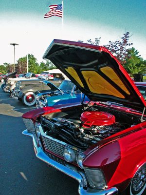 Revvin' in Rochester
Meticulously restored antique and classic cars line the parking lot of the Plumb Corner Mall in the Rochester Town Center during one of the recent Monday night Cruise Nights held throughout the summer. The weekly event features music, entertainment, raffles, and the opportunity to view some vintage vehicles. (Photo by Kenneth J. Souza).
