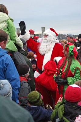 Merry in Marion
Santa Claus took time out of his busy schedule last weekend to visit all the good boys and girls in Marion during the town's Annual Christmas Village Stroll on Sunday, December 9. Saint Nick arrived via boat in Sippican Harbor and then took a horse-drawn carriage ride through the center of town. (Photo by Robert Chiarito).
