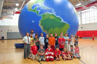 Global Warming
Students at Rochester's Memorial School were given a rare look at a scaled model of Planet Earth during a recent Earth Balloon program sponsored by professors from Bridgewater State College. (Photo by Robert Chiarito).
