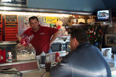 Fox at the Nest
The Nest Diner owner Randy St. John chats with Doug "VB" Goudie of Fox 25 Morning News during the recent segment of "Diner Wednesday" broadcast from the Mattapoisett establishment on December 3, 2008. (Photo by Robert Chiarito).
