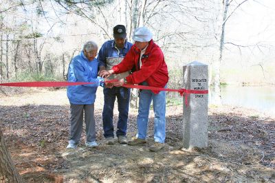 Saving Grace
The Mattapoisett Land Trust (MLT) formally dedicated the Grace Pond property located at the southern end of Bowman Road on Saturday, April 26, 2008. The pond and the surrounding nine acres were acquired from Abel and Libania Grace in December, 2006 and will help support environmental diversification in the 178 acres that the MLT owns extending from the Martocci Preserve on Marion Road to the MLT property on Aucoot Road. (Photo by Robert Chiarito).
