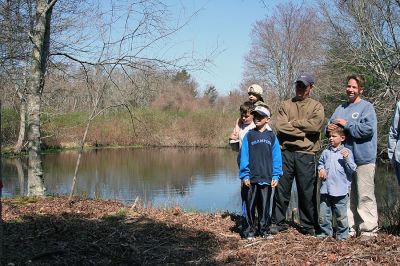 Saving Grace
The Mattapoisett Land Trust (MLT) formally dedicated the Grace Pond property located at the southern end of Bowman Road on Saturday, April 26, 2008. The pond and the surrounding nine acres were acquired from Abel and Libania Grace in December, 2006 and will help support environmental diversification in the 178 acres that the MLT owns extending from the Martocci Preserve on Marion Road to the MLT property on Aucoot Road. (Photo by Robert Chiarito).
