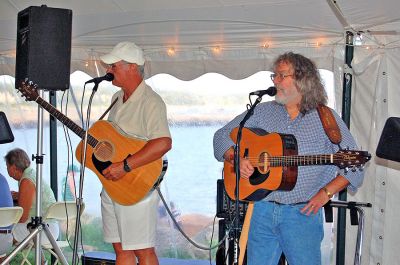 Harbor Days 2007
Mattapoisett's annual seaside Harbor Days festival, sponsored by the Mattapoisett Lions Club, was held in Shipyard Park on the weekend of July 20-22, drawing thousands of people who enjoyed craft booths, great food, amazing entertainment, and some hometown pride. Here artists Couto and Mulligan headline Friday night. (Photo by Rebecca McCullough).
