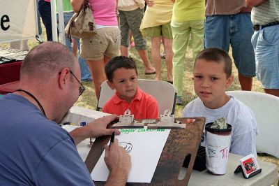 Harbor Days 2007
Mattapoisett's annual seaside Harbor Days festival, sponsored by the Mattapoisett Lions Club, was held in Shipyard Park on the weekend of July 20-22, drawing thousands of people who enjoyed craft booths, great food, amazing entertainment, and some hometown pride. (Photo by Robert Chiarito).
