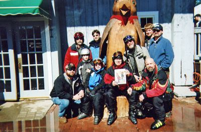 Hathaway Getaway
Three generations of the Hathaway clan get together every winter for an All Boys Ski Trip. Here Ken Hathaway Sr. (center, holding a copy of The Wanderer), is accompanied by his six sons and three grandsons in North Conway, NH. Bottom row, l. to r., Robert, Ethan, Jonathan, Grampa Ken, and Stephen. Back row, l. to r., Mark, Timmy, Noah, and Malcolm Hathaway.
