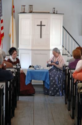 High Tea and Gossip
Lucy Bly and Katherine Gaudet played the roles of two gossiping ship captains wives for the Mattapoisett Museum and Carriage Houses High Tea and Historic Gossip session held on Sunday, March 11. The creative program was an informal way of discussing historic events and tidbits of local gossip from the 1860s while being treated to a lively performance from the role-playing characters. (Photo by Robert Chiarito).
