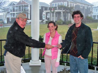 Road Race Scholars
Mattapoisett Road Race Committee Chairman Daniel White presents $1,000 scholarship checks to students Mary Jayne Menezes and Greg Correia, both of Mattapoisett, in the towns historic Shipyard Park. These were just two of eight scholarships awarded to local students upon completion of their first semester in higher education. (Photo courtesy of Daniel White).
