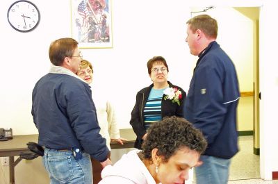 Rochester COA Director
Various Rochester town officials and residents gathered at the Rochester Senior Center last week to meet and greet the towns newly-hired Council on Aging (COA) Director, Sharon Lally (third from left, with corsage). Here she is seen chatting with (l. to r.) Mike Muenier, Patricia Ryan, and Police Chief Paul Magee during the event (Photo by Kenneth J. Souza).

