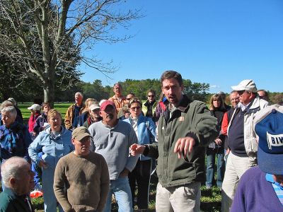 East Over Opening
Steve Sloan, the Southeast Regional Director of the Trustees of Reservations (center, pointing) leads a tour of the newly-opened East Over Farm in Rochester during the recent Grand Opening Celebration. The 75-acre conservation area is now open for public use with walking trails that abut historic stone walls encasing some of the most scenic fields, woods, and ponds in the tri-town area. The Grand Opening drew over 200 participants who came to celebrate the event. (Photo by Nancy MacKenzie).
